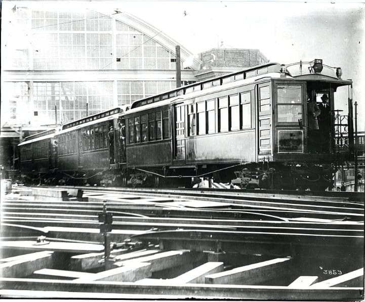 A test train at Sullivan Square Station in Boston around 1900. The man at right appears to be Frank Sprague, whose invention of multiple unit control made the operation of the train possible.